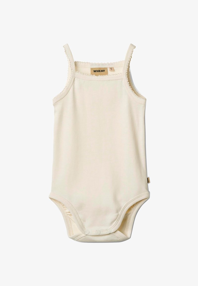 Body en coton de couleur crème avec des fines bretelles, un ourlet en dentelle, des boutons-pression en bas et une petite étiquette de la marque sur le côté.