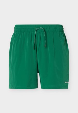 Zöld fürdőnadrág rugalmas derékpánttal és húzózsinórral, jobb alsó lábszáron kis fehér "30904" felirattal.