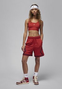 Jordan JORDAN SPORT - Športni modrček s srednjo podporo - dune red/(white)