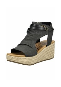 Black fabric wedge sandal with crisscross straps, open toe, and jute-wrapped heel. Features a side zipper and embossed logo detail.