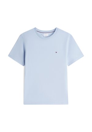 Light blue short-sleeve crew neck T-shirt with a small rectangular red, white, and navy logo on the left chest.