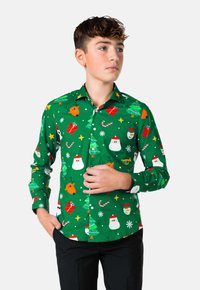 Camicia verde a maniche lunghe con motivi a tema natalizio: facce di Babbo Natale, alberi, regali e fiocchi di neve. Chiusura con bottoni e colletto classico.