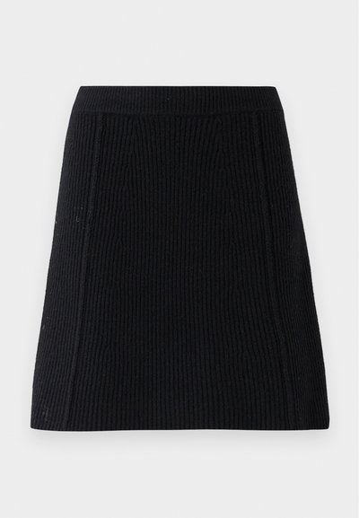 Black knitted skirt with a ribbed texture and a flared shape. Features vertical seams for structure and a solid waistband at the top.