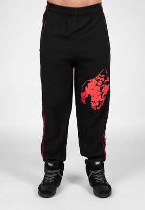 OLD SCHOOL - Tracksuit bottoms - red