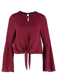Bordeaux cropped bluse med knyttet forside, udvidede lange ærmer og en nøglehul detalje ved halsudskæringen, lavet af letvægtsstof.