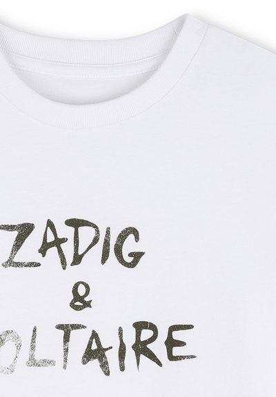 Λευκό t-shirt με στρογγυλή λαιμόκοψη και μαύρο κείμενο με χειρόγραφο στυλ "ZADIG & VOLTAIRE" τυπωμένο στο μπροστινό μέρος.