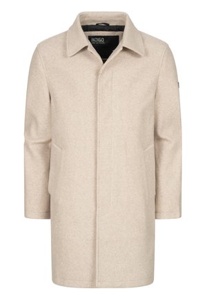 Beige ullfrakk med rett snitt, spiss krage, to sidelommer og en minimalistisk stil. Svart fôr synlig ved kragen.