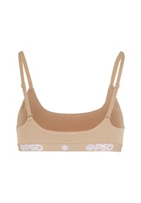 Nude bralette med justerbare stropper, glatt tekstur og bred hvit elastisk bånd med "PSD"-logoen. U-formet halslinje.