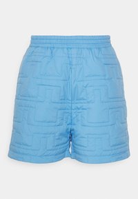 Quilted shorts in light blue, featuring a textured geometric pattern, elastic waistband, and a relaxed fit with side seams.