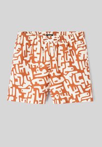 Shorts de bain blancs et orange avec un motif abstrait en forme de labyrinthe, taille élastique et cordon blanc à nouer au centre devant.