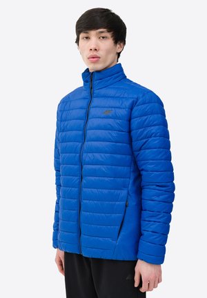 Blue padded jacket with a high collar, front zipper, and side pockets. Smooth texture with a quilted pattern, made of lightweight material.
