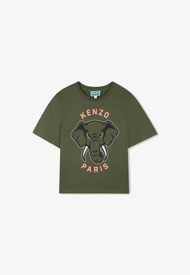 T-shirt à manches courtes vert olive avec un graphique noir d'éléphant aux défenses blanches, et le texte "KENZO PARIS" en rose. Matière coton.