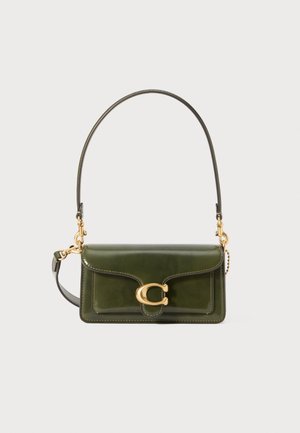 Green leather handbag with a flap, gold hardware, and a chain strap. Features a prominent logo clasp and curved lines in the design.