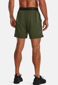 Under Armour VANISH WOVEN - Sports shorts - marine od green