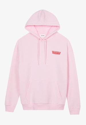 Light pink hoodie made of soft fabric, featuring a kangaroo pocket, ribbed cuffs, and the word "DELICIOUS" in red on the chest.