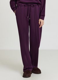 Lila elastische Bundhosen mit einem Kordelzug und Seitentaschen, mit einer glatten Textur und einem geraden Bein.