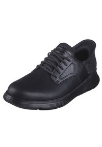 Scarpa in pelle nera con punta arrotondata e dettagli in tessuto testurizzato. Caratterizzata da lacci neri e una suola flessibile e ammortizzata.