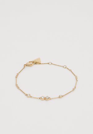 Gold bracelet featuring thin, elongated links with round and diamond-shaped clear accents, including sparkling gem-like details and lobster clasp.