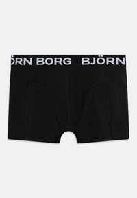 Boxer shorts noirs en coton, avec une taille blanche comportant le logo "BJÖRN BORG", et un design ajusté avec des détails de couture sur les côtés.