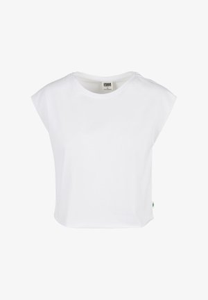 Vit kortärmad croppad t-shirt med rund halsringning och avslappnad passform. Tillverkad av mjuk bomull, med en liten grön logotypetikett på sidan.