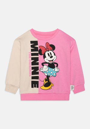 Sweat-shirt pour enfants avec une manche gauche beige et une manche droite rose, présentant un motif Minnie Mouse et le texte "MINNIE THE ORIGINAL".