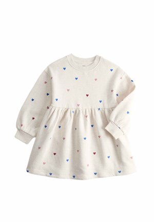 Vestito per bambina color crema a maniche lunghe con vita arricciata e piccoli motivi di cuori blu, rosa e rossi sparsi.