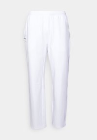 Vita sweatpants med rak passform, elastiskt midjeband och sidofickor, med en liten grön krokodil-logotyp på vänster ficka.