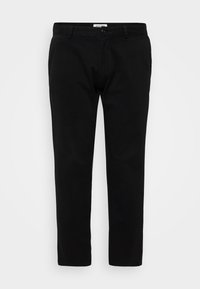 Black trousers in a slim fit design, featuring a flat front, belt loops, and a zip fly with button closure. Made of smooth, sturdy fabric.