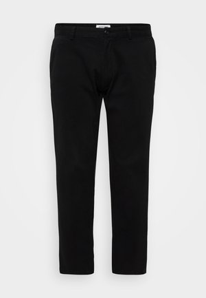 Black trousers in a slim fit design, featuring a flat front, belt loops, and a zip fly with button closure. Made of smooth, sturdy fabric.