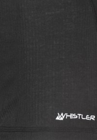 Svart tyg med ribbad textur, med vit broderad "Whistler"-logotyp. Slät, stretchig material med en ren design.