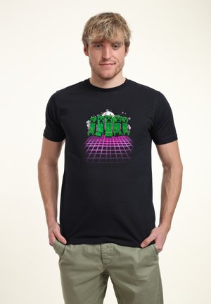 Black t-shirt featuring a graphic design of green pixelated characters set against a purple grid and light effects, cotton material.