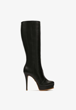 Knee-high black leather heeled boot with a platform, sleek design, smooth texture, and a pointed toe. Features a high stiletto heel.
