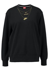 Sudadera negra hecha de tela suave, con mangas largas, cuello redondo y tres logotipos dorados de Nike con el texto "Just Do It" en el pecho.