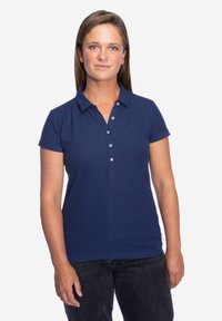 Marineblauwe polo shirt van katoen, met een kraag, korte mouwen en knoopsluiting, voorzien van een subtiele logo-detail op de borst.