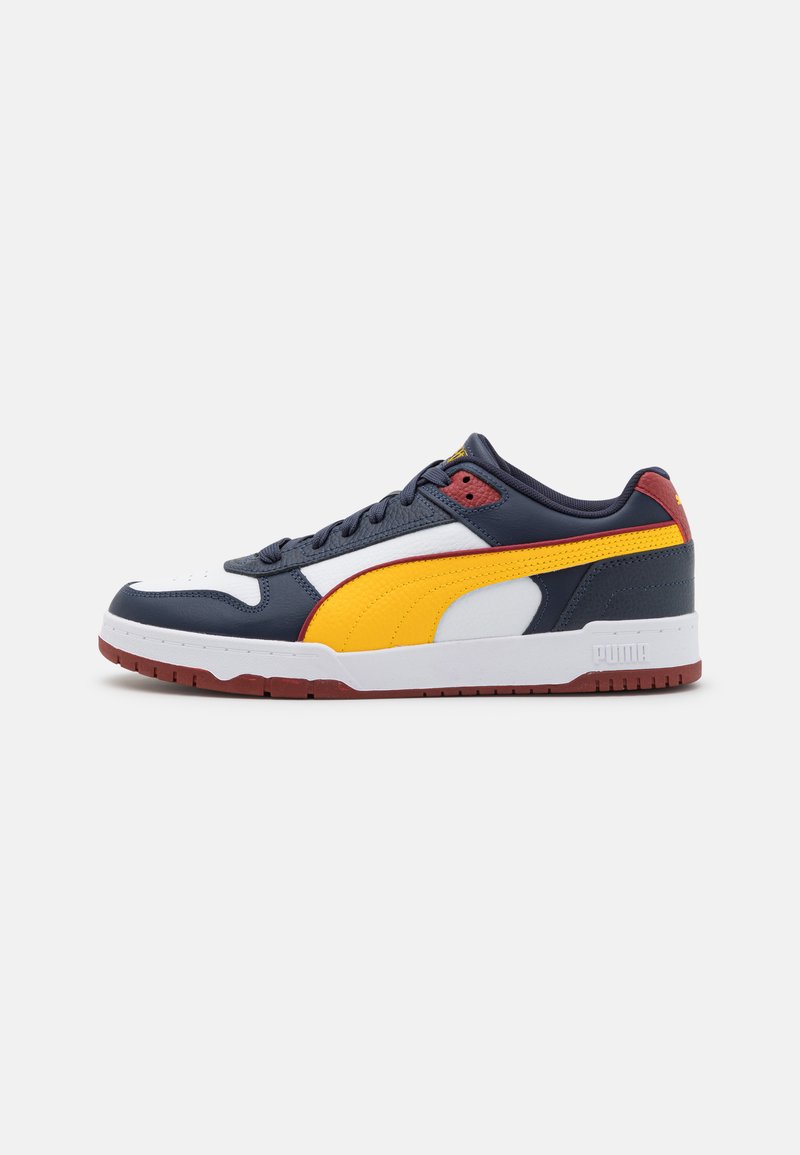 Blue and yellow sneakers with white accents, leather and mesh upper, featuring a rubber outsole and textured detail on the toe.