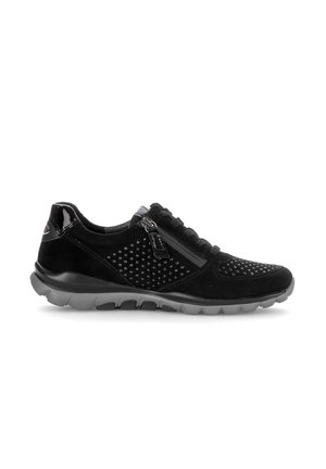 Black casual sneaker with gray sole, side zipper, laces, and small perforated details on the upper part for ventilation.