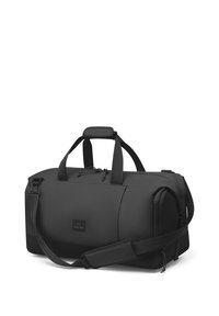 Musta kassi valmistatud vastupidavast kangast. Omab kaht käepidemeid, reguleeritavat õlarihma, lukuga taskut ja logo detaili. Sile tekstuur.