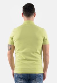 K-Way AMEDEE - Polo - giallo