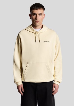 Lichtgele hoodie met een voorzak, capuchon met trekkoord en geborduurd logo. De stof lijkt zacht en heeft een ontspannen pasvorm.