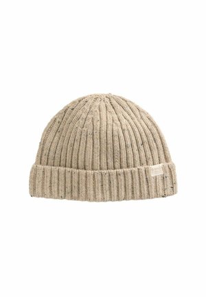 Beige ribbed knit beanie hat with folded cuff and small fabric tag on the side against a white background.