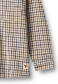 Geruit overhemd in beige en marineblauw, gemaakt van een textuurstof, met een borstzak en een geweven merklabel aan de zoom.