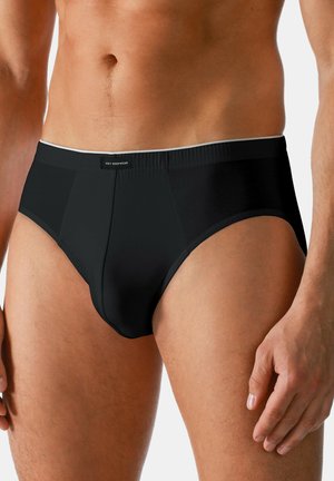 Slip neri da uomo realizzati in tessuto liscio, con un taglio classico, vita elasticizzata con profilo a contrasto e dettagli di cucitura sul pannello frontale.