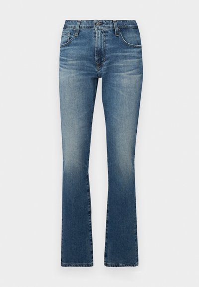 Denim flared jeans in medium blue with a faded finish, featuring a classic five-pocket design and metal hardware accents.