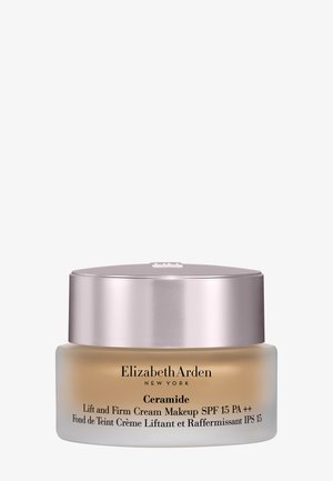 Pot de maquillage Elizabeth Arden Ceramide Lift and Firm Cream avec SPF 15, teinté beige, couvercle à vis argenté.