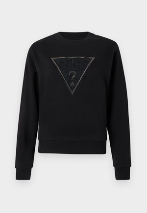 Sweat-shirt noir à col rond, avec un panneau texturé triangulaire orné de clous et le mot "GUESS" au-dessus d'un point d'interrogation.
