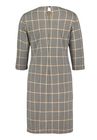 Rutig klänning i svart, vitt och gult. Trekvartsärmar, nyckelhål baktill, skräddarsydd passform, texturerad tyg.