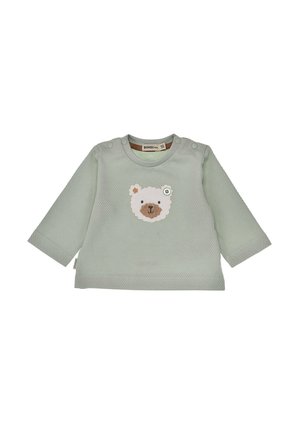 Light green textured baby shirt with long sleeves and a small white bear face applique on the chest, featuring snap buttons on shoulders.
