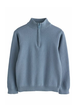 Pull bleu clair avec un col montant et une fermeture éclair quart. Tissu tricoté doux et texturé. Poignets et ourlet à côtes.