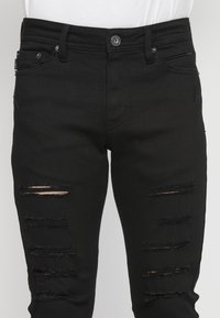 Koroshi Oprijete (skinny) kavbojke - denim black denim
