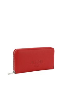 Rdeča usnjena denarnica z teksturirano površino in zadrgo. Na sprednji strani je vtisnjen logo "JOOP! JEANS". Tanek pravokoten oblik.